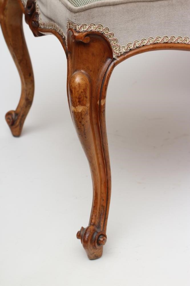 A VICTORIAN WALNUT DRESSING STOOL of long form with overstuffed seat in pale green floral gros point Image