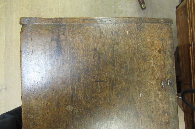 AN OAK PANELLED COFFER Image