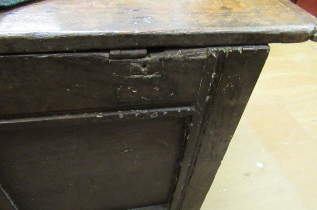 AN OAK PANELLED COFFER Image