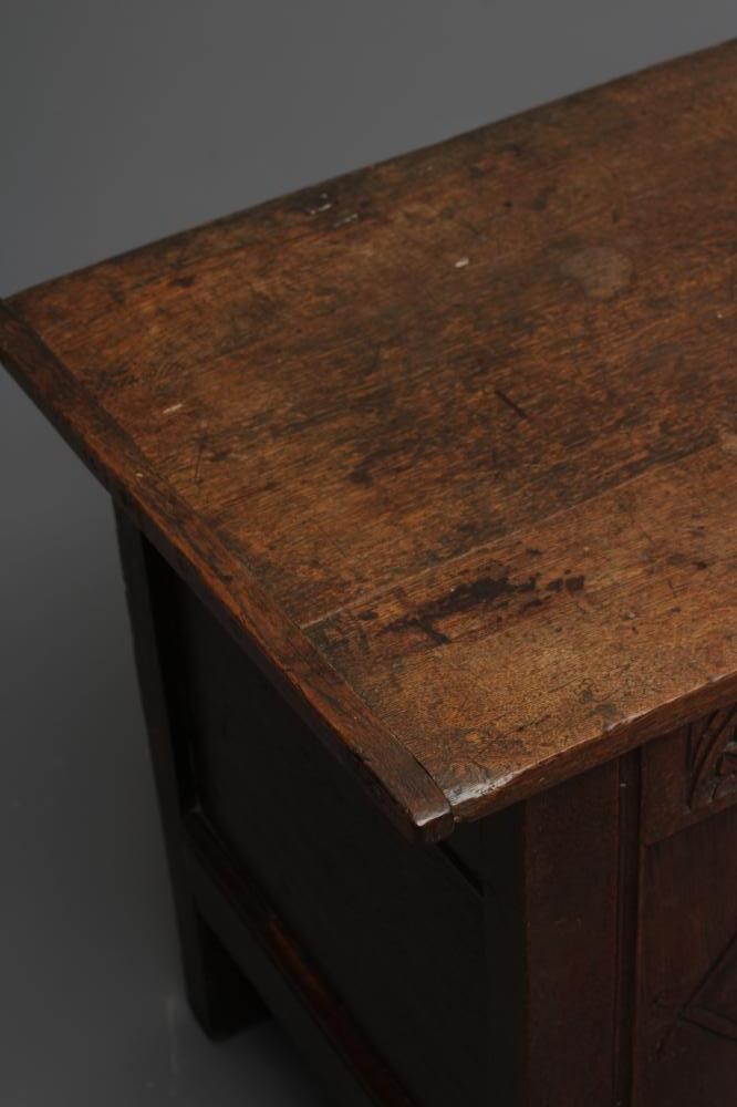 AN OAK PANELLED COFFER Image