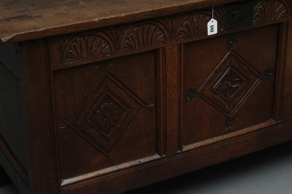 AN OAK PANELLED COFFER Image