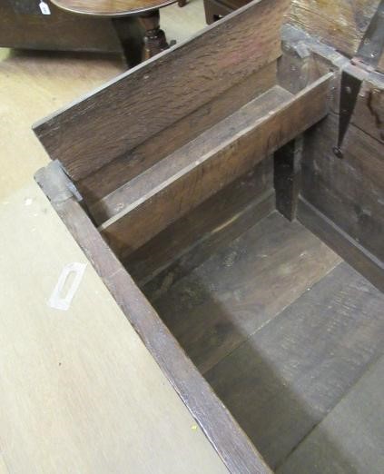 AN OAK PANELLED COFFER Image