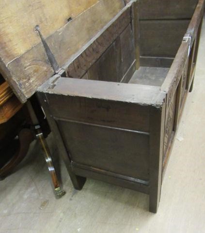AN OAK PANELLED COFFER Image