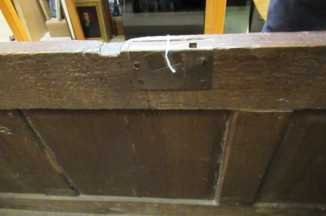 AN OAK PANELLED COFFER Image
