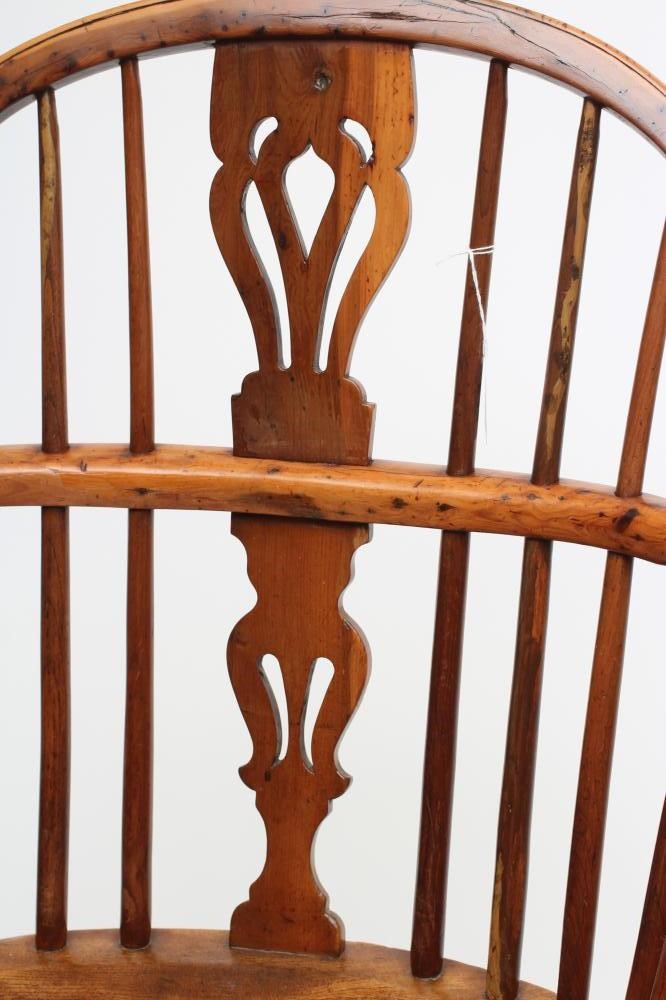 A YEW WINDSOR ARMCHAIR Image