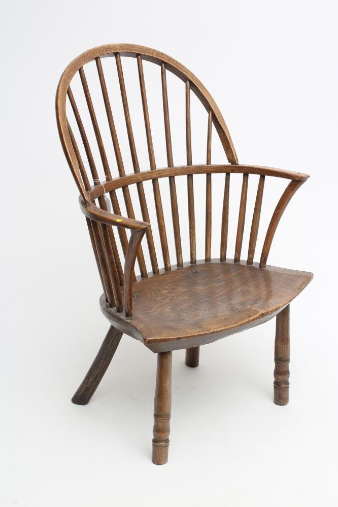 A WINDSOR SPINDLE BACK ARMCHAIR in ash and elm Image