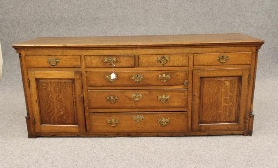 A GEORGIAN OAK ENCLOSED DRESSER Image