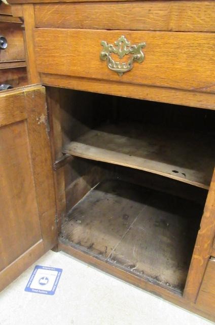 A GEORGIAN OAK ENCLOSED DRESSER Image