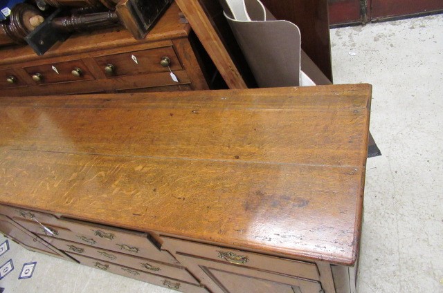 A GEORGIAN OAK ENCLOSED DRESSER Image