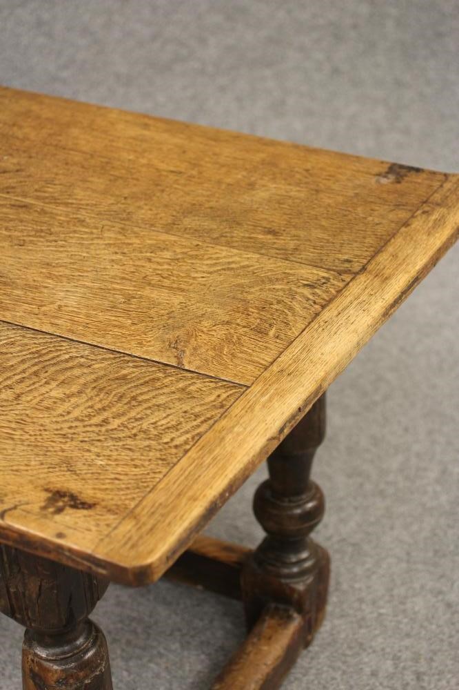 A JOINED OAK DINING TABLE Image