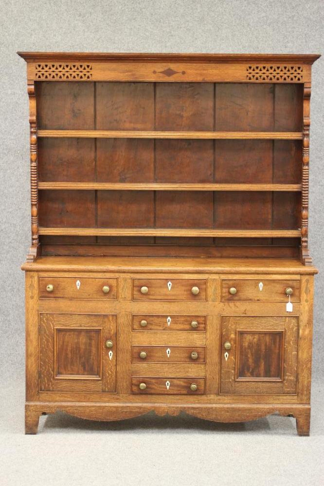 A LATE GEORGIAN OAK DRESSER Image