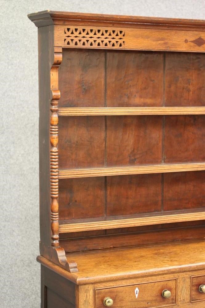 A LATE GEORGIAN OAK DRESSER Image