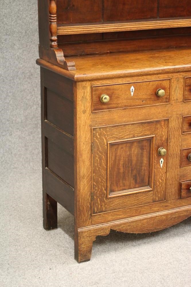 A LATE GEORGIAN OAK DRESSER Image