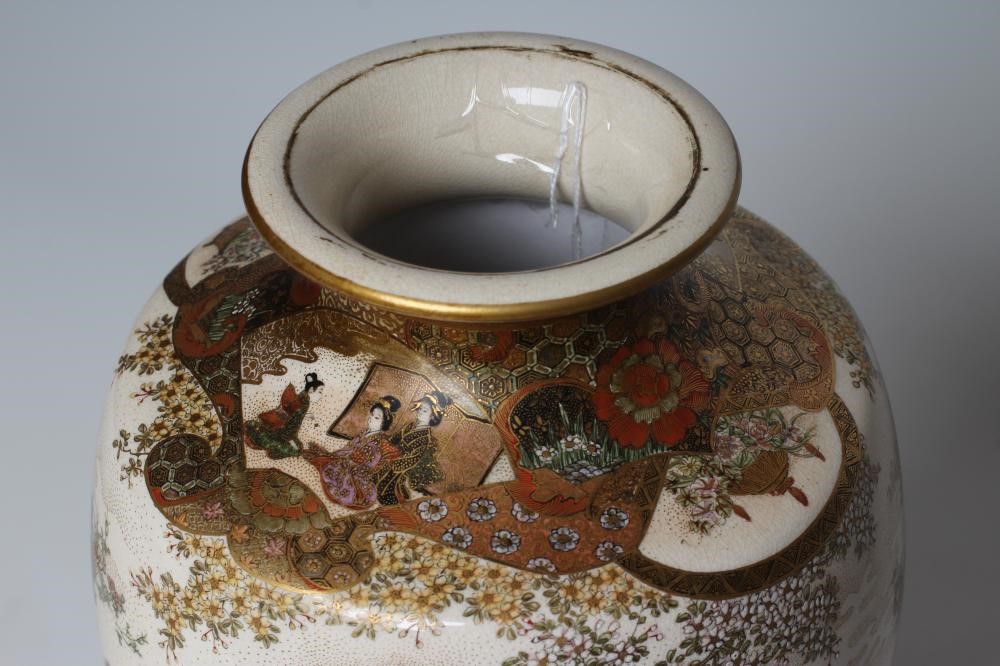 A JAPANESE PORCELAIN VASE of bombe cylindrical form with two fixed ring and rosette handles Image