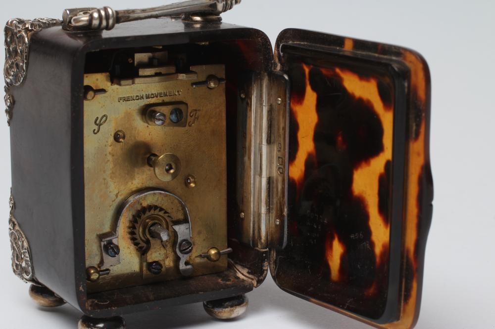 A LATE VICTORIAN SILVER MOUNTED TORTOISESHELL DRESSING TABLE TIMEPIECE Image