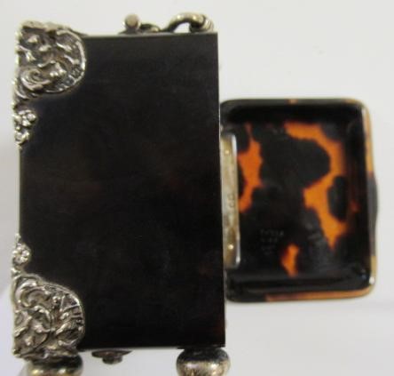 A LATE VICTORIAN SILVER MOUNTED TORTOISESHELL DRESSING TABLE TIMEPIECE Image