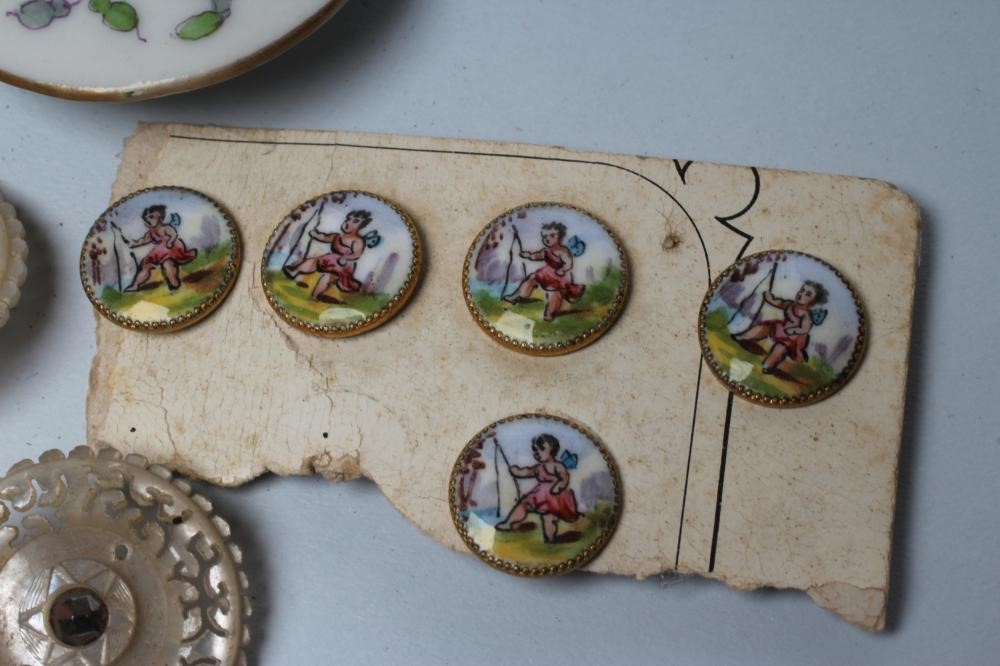 A SET OF NINE GEORGIAN MOTHER OF PEARL BUTTONS carved and pierced with vermiculae and set with cut Image
