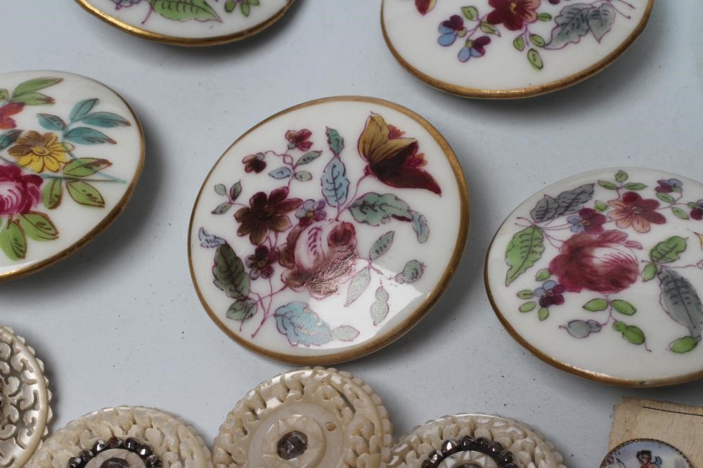 A SET OF NINE GEORGIAN MOTHER OF PEARL BUTTONS carved and pierced with vermiculae and set with cut Image