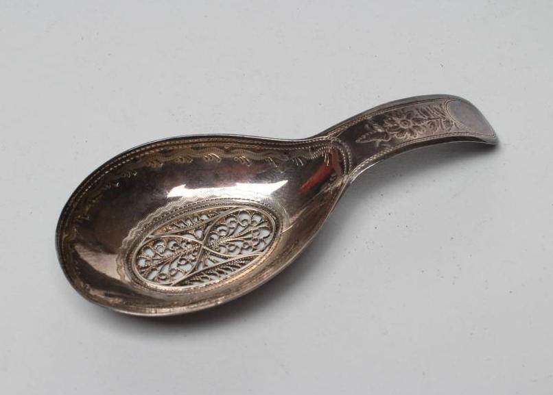 A LATE GEORGE III SILVER CADDY SPOON Image