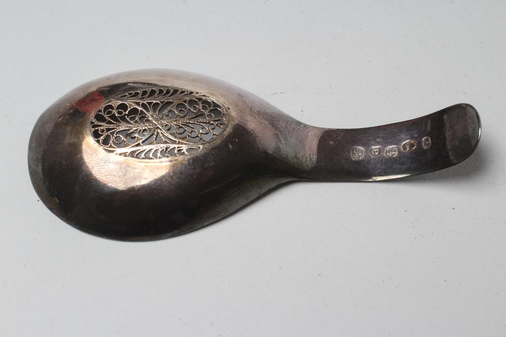 A LATE GEORGE III SILVER CADDY SPOON Image