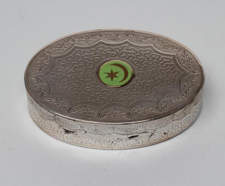 A WHITE METAL OVAL BOX Image