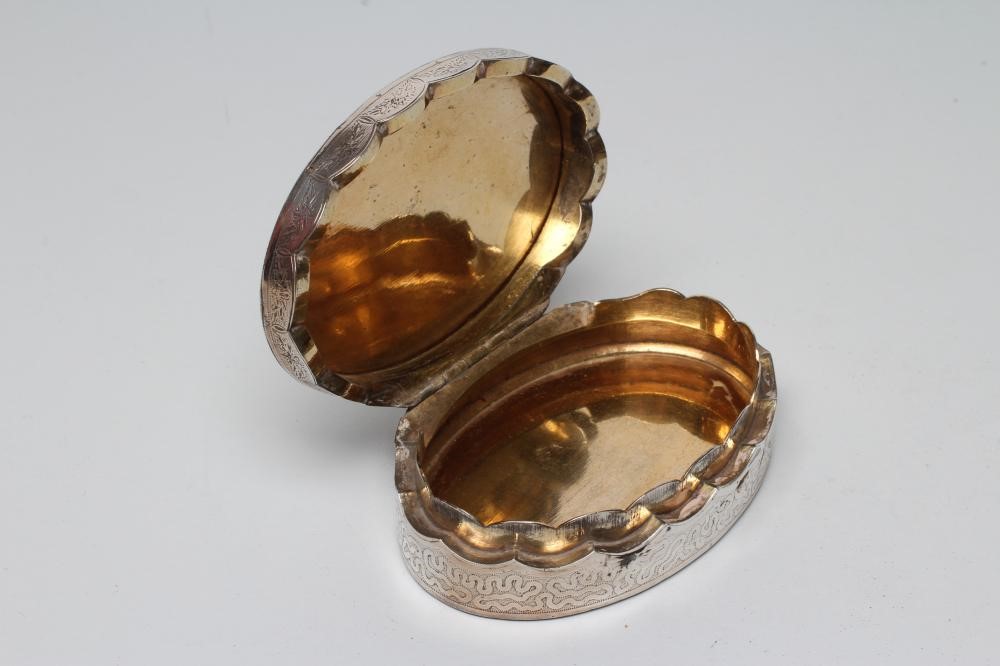 A WHITE METAL OVAL BOX Image