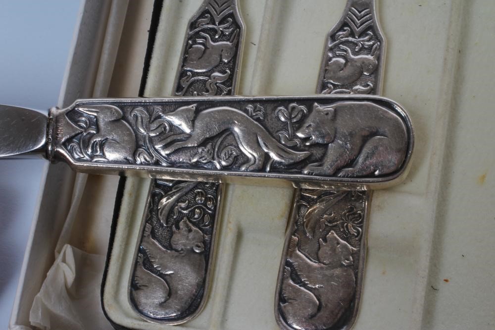 A SILVER THREE PIECE CHRISTENING SET Image