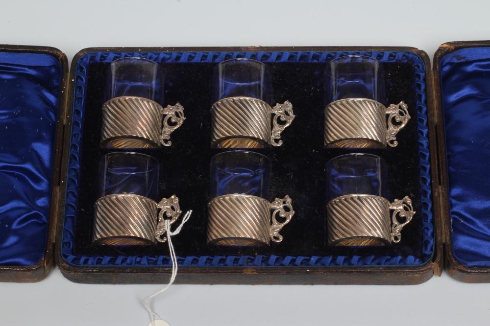 A SET OF SIX LATE VICTORIAN SILVER TOT HOLDERS Image