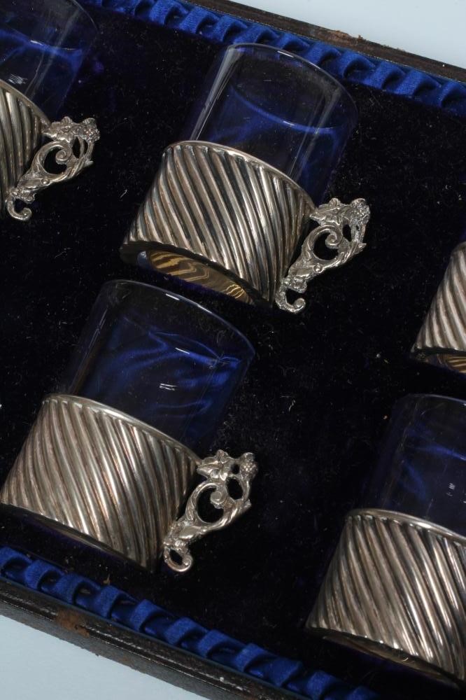 A SET OF SIX LATE VICTORIAN SILVER TOT HOLDERS Image