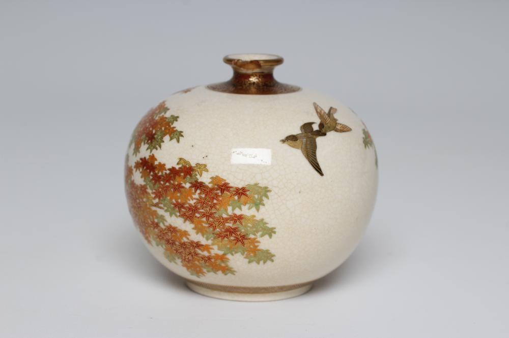 A SATSUMA EARTHENWARE SMALL VASE of bombe cylindrical form painted in shades of orange and green Image