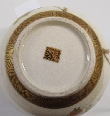 A SATSUMA EARTHENWARE SMALL VASE of bombe cylindrical form painted in shades of orange and green Image