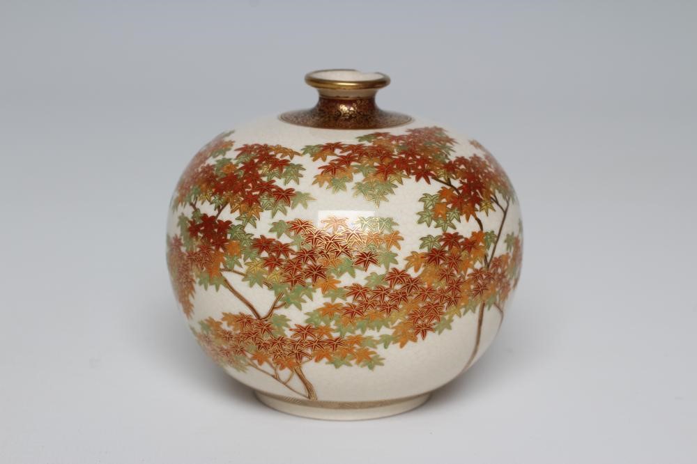 A SATSUMA EARTHENWARE SMALL VASE of bombe cylindrical form painted in shades of orange and green Image
