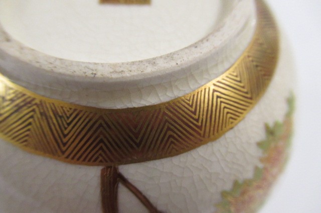 A SATSUMA EARTHENWARE SMALL VASE of bombe cylindrical form painted in shades of orange and green Image