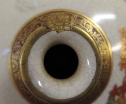 A SATSUMA EARTHENWARE SMALL VASE of bombe cylindrical form painted in shades of orange and green Image