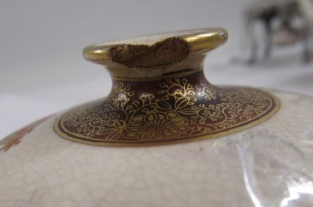 A SATSUMA EARTHENWARE SMALL VASE of bombe cylindrical form painted in shades of orange and green Image