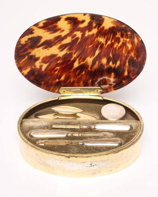 AN ART DECO SILVER GILT MOUNTED TORTOISESHELL CASED MANICURE SET Image
