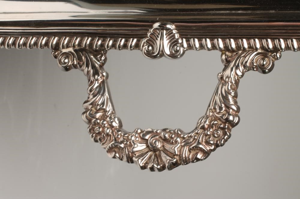 A SILVER TWO HANDLED TRAY Image