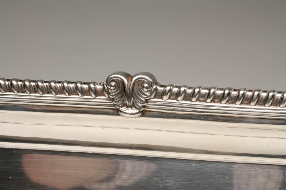 A SILVER TWO HANDLED TRAY Image