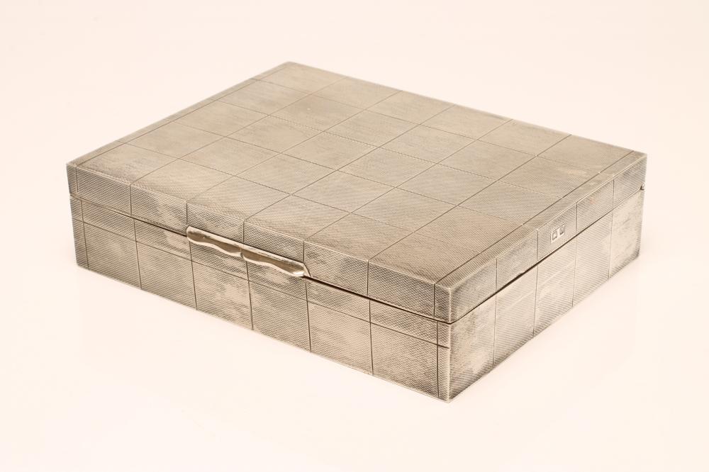 AN ART DECO SILVER CIGARETTE BOX Image