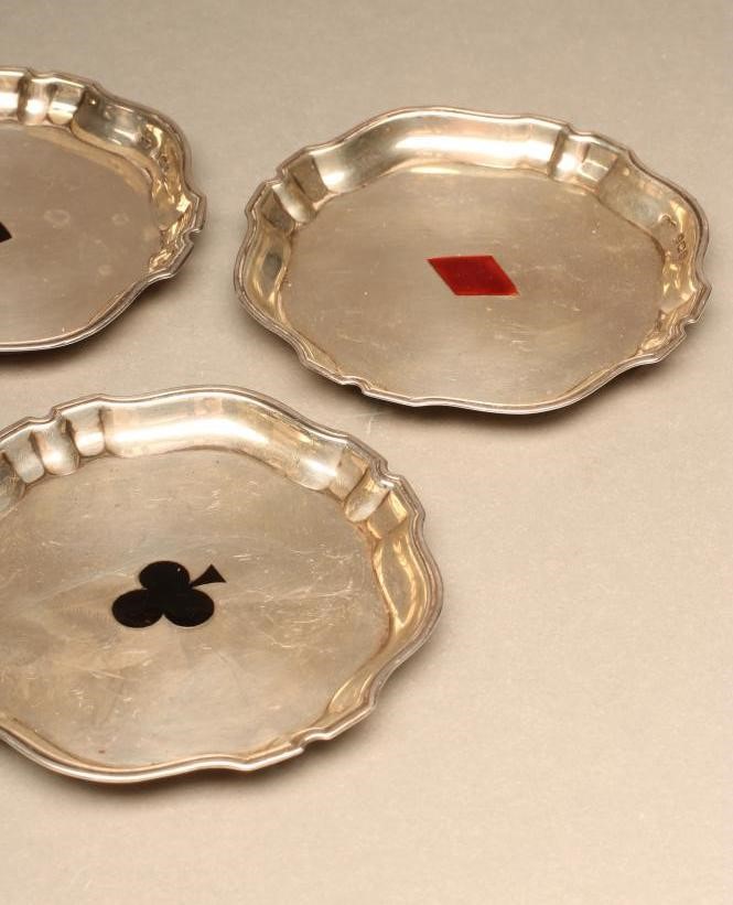 A SET OF FOUR SILVER BRIDGE COASTERS Image