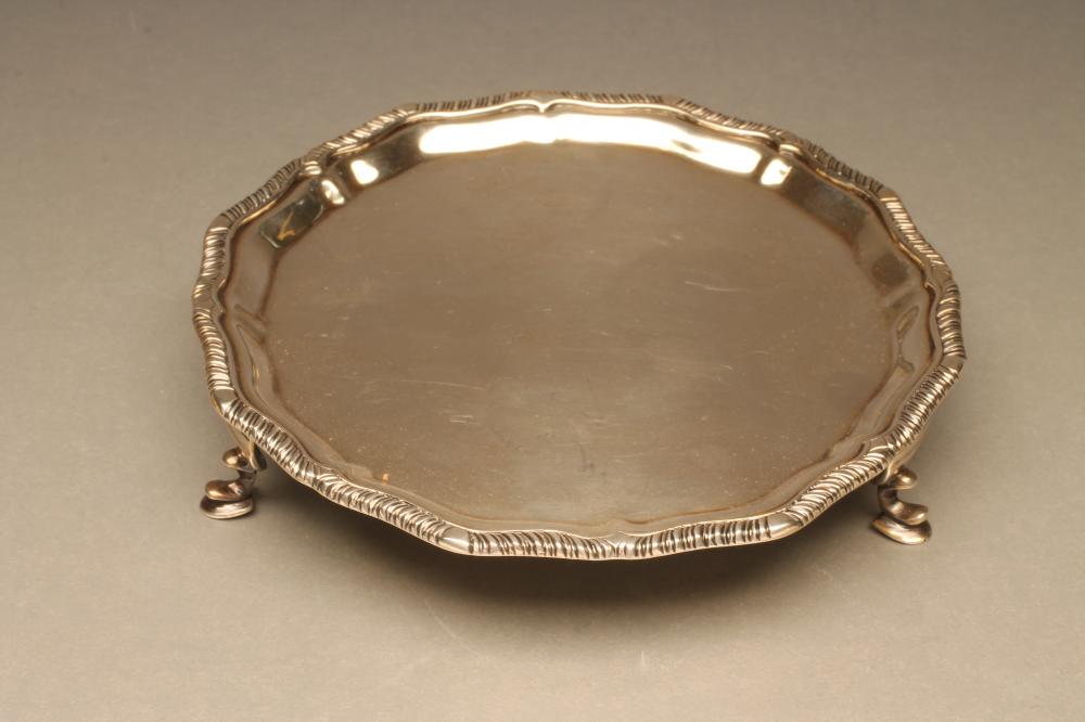 A LATE VICTORIAN SILVER WAITER Image