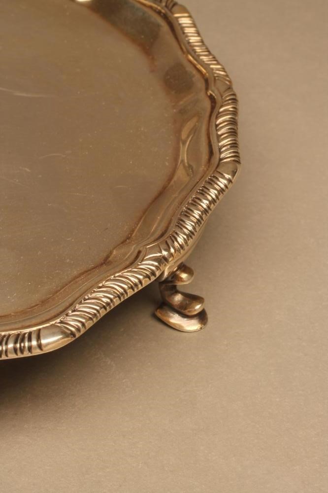 A LATE VICTORIAN SILVER WAITER Image