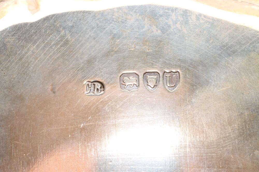 A LATE VICTORIAN SILVER WAITER Image