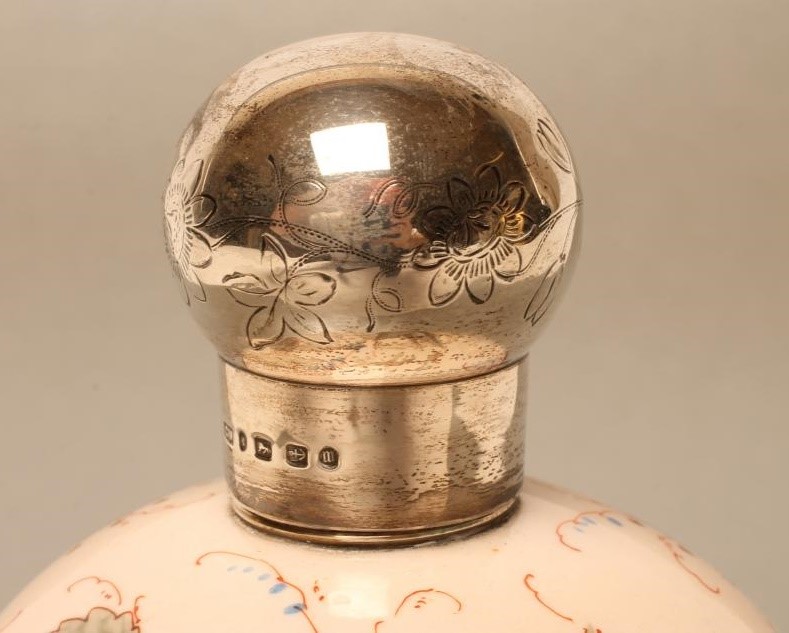 A VICTORIAN SILVER MOUNTED PALE PINK OVERLAY GLASS EAU DE TOILETTE BOTTLE Image