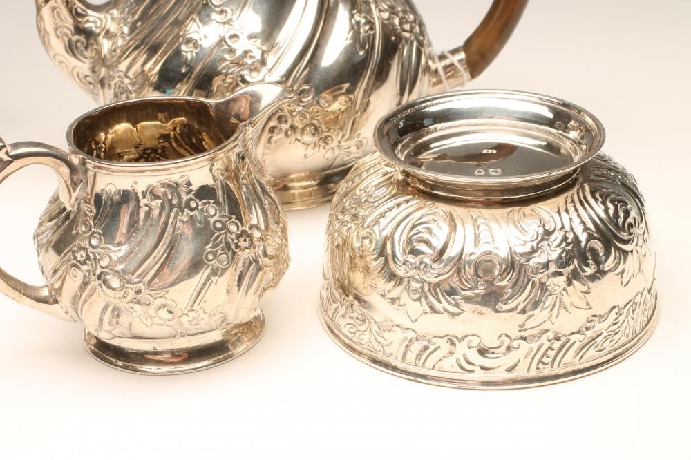 A VICTORIAN BACHELOR'S SILVER TEAPOT AND MILK JUG Image