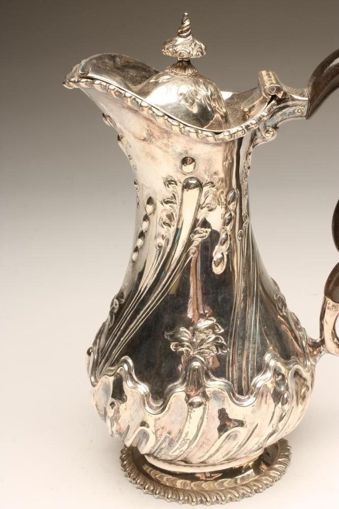 A VICTORIAN BACHELOR'S SILVER TEAPOT AND MILK JUG Image