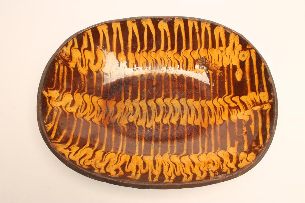 AN ENGLISH COUNTRY SLIPWARE DISH Image