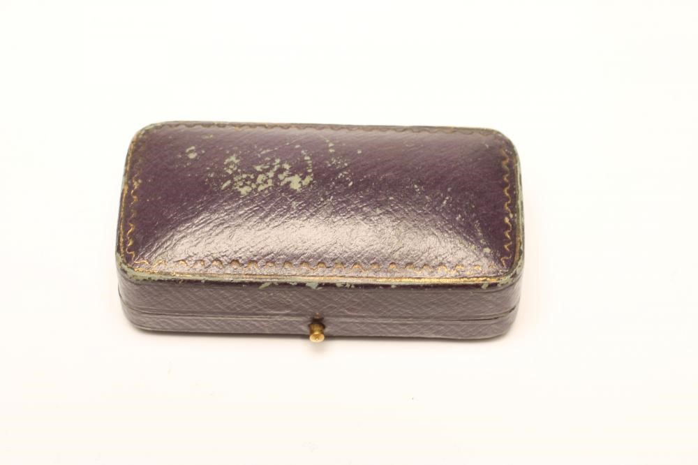 A NOVELTY STOCK BROOCH centred by a fox in flight with a ruby cabochon eye Image