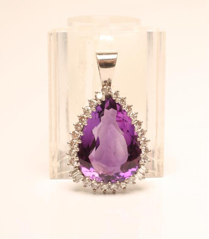 AN AMETHYST AND DIAMOND PENDANT Image
