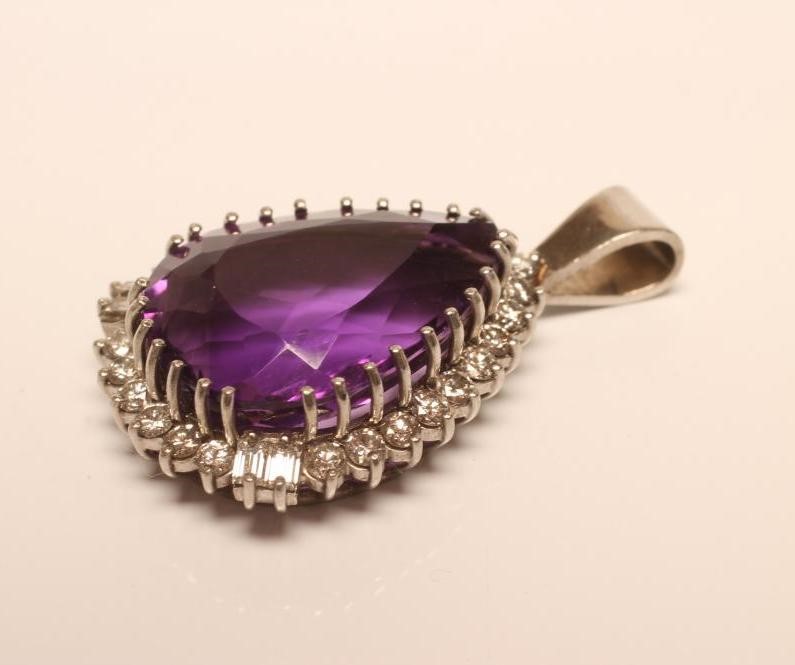 AN AMETHYST AND DIAMOND PENDANT Image